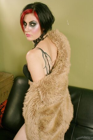 Eccentric alt brunette takes off fur coat and touches her twat near gramophone