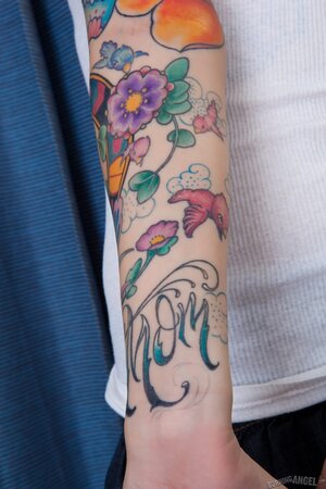 Young woman with colorful tattoos don't feel shy to flash her shaved vagina