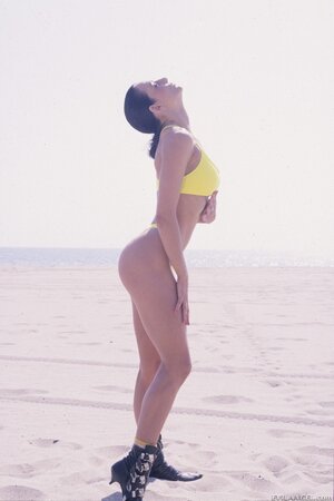 Guy in red bandana plays guitar pretty well but girls are interested in threesome