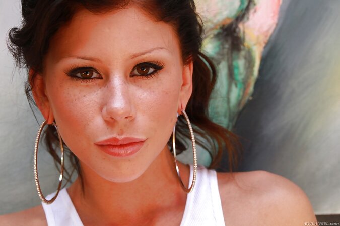 Director films little strip show performed by black-haired seductress