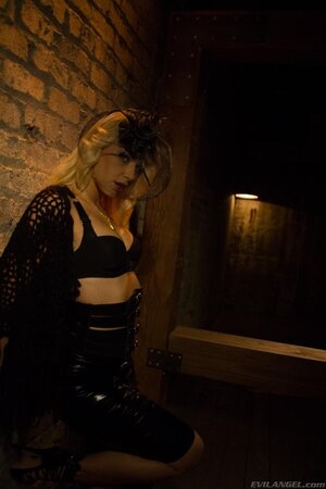 Ravishing vampire sneaks in darkened cellar to show juicy boobs near wall