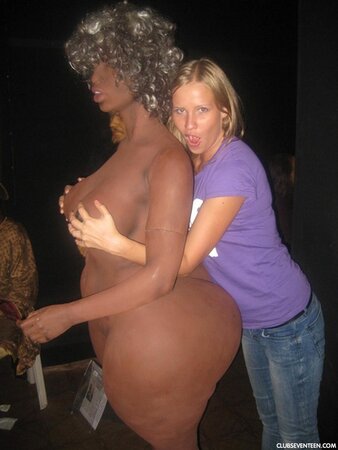 Blonde girl thinks about sex even when she is at the exhibition of wax figures