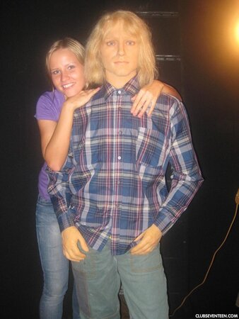 Blonde girl thinks about sex even when she is at the exhibition of wax figures