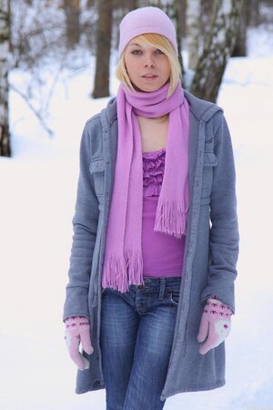 Sweet blonde is so hot that can melt the snow stripping down in the winter