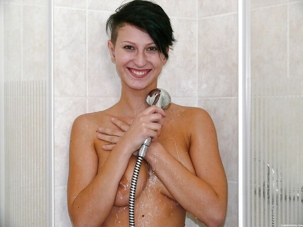 Girl with short haircut enters shower cabin and scores trimmed muff with fingers