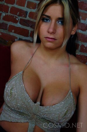 Dirty-minded blonde takes off sexy top and pants to flaunt her big beautiful tits