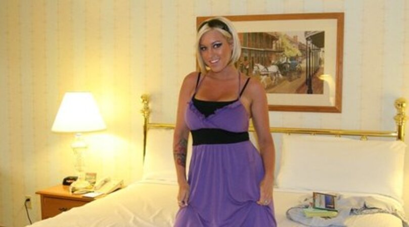 Tanned blonde with a bob cut doesn't mind showing her amazing big boobs