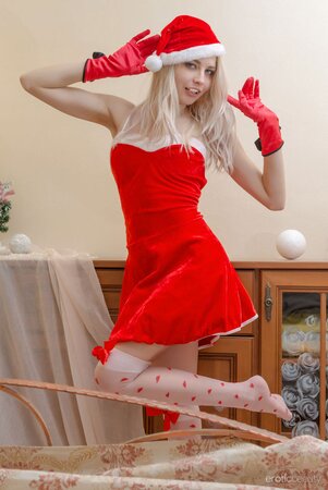 Slim blonde chick poses in sexy Xmas outfit and reveals her natural beauty