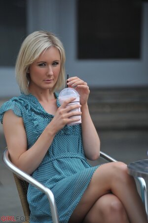 Lovely blonde flashes panties before taking them off to pose nude at home