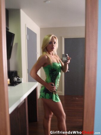 Lovely blonde cutie teases by undressing and revealing her tempting curves