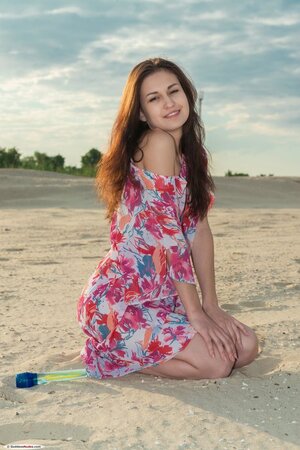 Attractive babe shows her pink hole and nice tits after stripping on the beach