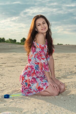 Attractive babe shows her pink hole and nice tits after stripping on the beach