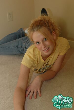 Babe doffs jeans and top stripping to panties and bra for the camera