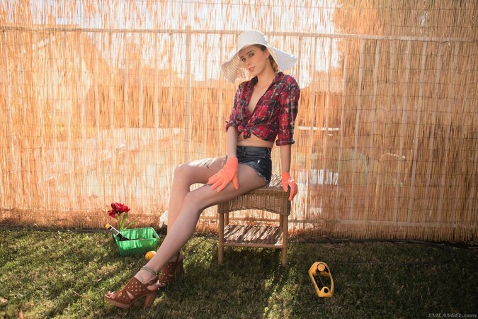 Desperately sexy girl Haley Reed goes to greenhouse to water flowers with urine