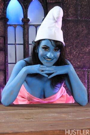 Juicy chick dressed like naughty Smurf exposes her perky tits and pink cunny