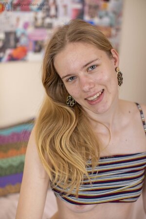 Clara M is showing off her naturally small boobs and more