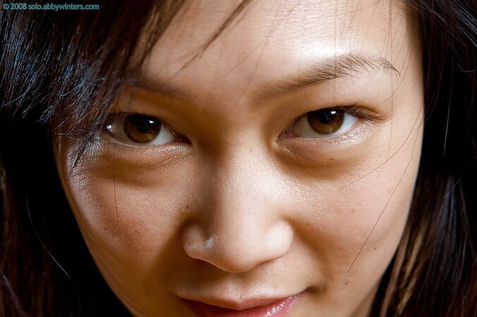 Asian seductress with a confident gaze is ready to show off