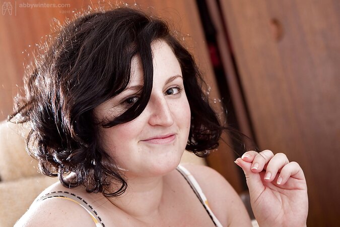 Brunette with natural boobs teasing you and looking real hot