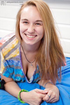 Natural boobs babe keeps her legs raised as she shows her body