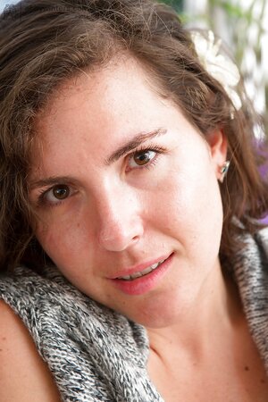 Brunette with a hairy twat puts on sexy socks and masturbates