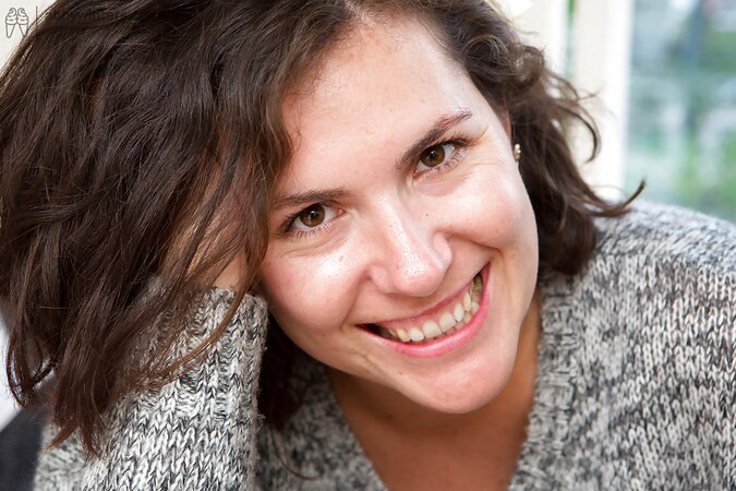 Brunette with a hairy twat puts on sexy socks and masturbates