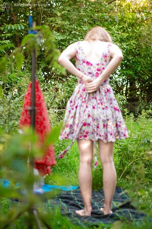 Skinny babe decides to strip outside to show off her body