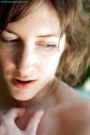 Brunette with natural breasts is going to showcase them outside