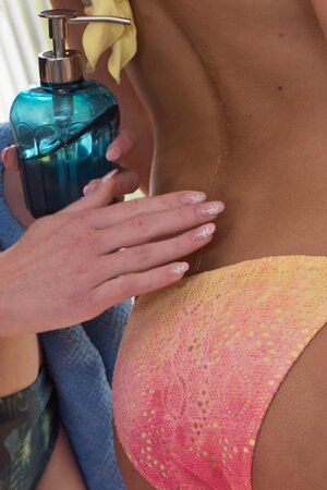 Blondie with long legs fingered from behind by the mirror