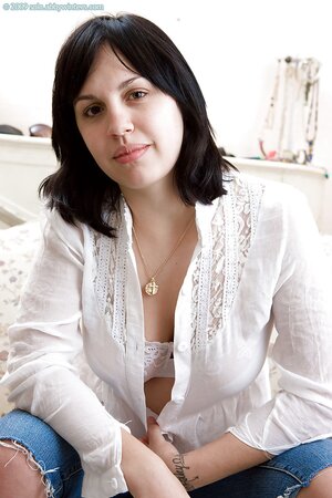 Raven haired hottie is going to show her hairy hole while teasing