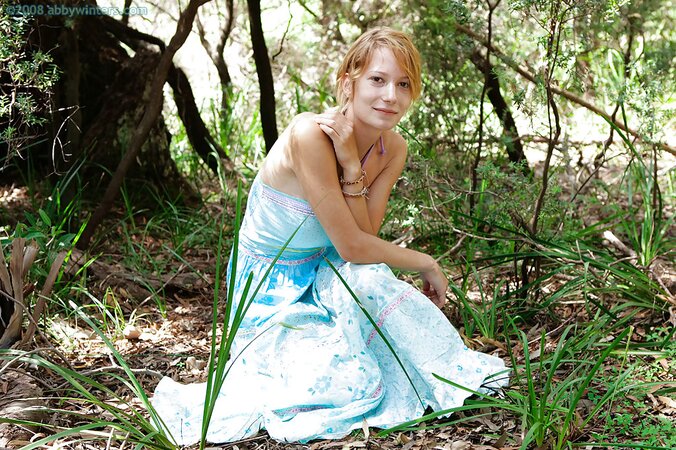 Redheaded adventurer showing her firm ass in the woods too