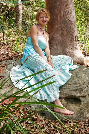 Redheaded adventurer showing her firm ass in the woods too