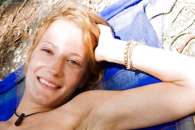 Redheaded adventurer showing her firm ass in the woods too