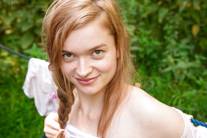 Redheaded beauty with insane curves shows off while outside