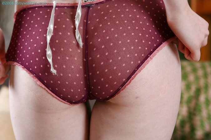 Redheaded beauty shows her crotch and sexy looking booty