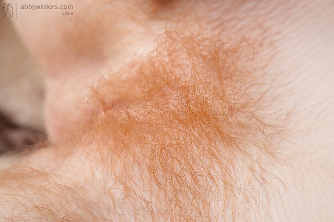 Redheaded firecrotch brushing her pussy hair and looking good