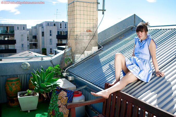 Rooftop posing from a girl who has a juicy hairy slit to show