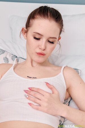 Angelic chick shows her pink pussy to keep you aroused for real