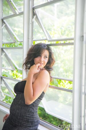 Lovely brunette grabbing her own ass and looking pretty