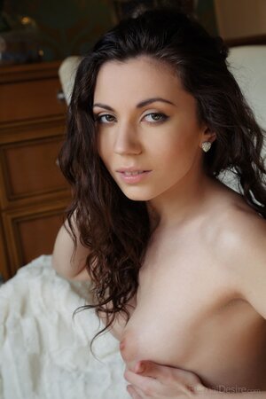 Attractive brunette with tan lines is ready to go on all fours