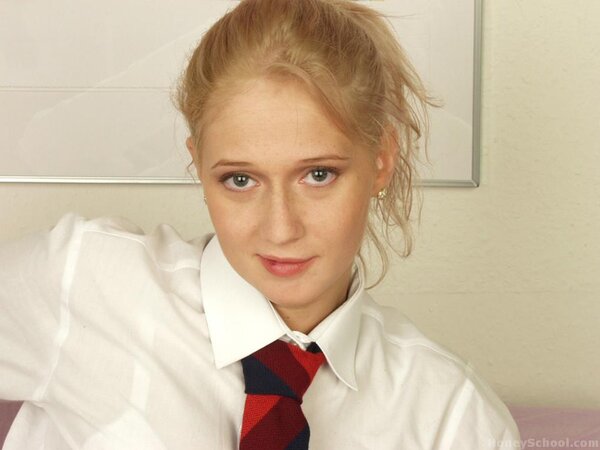 Schoolgirl removes her outfit and plays with a large carrot