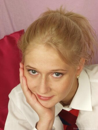 Schoolgirl removes her outfit and plays with a large carrot