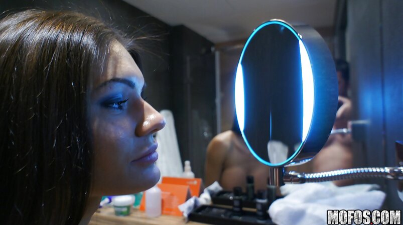 Busty brunette poses naked in font of the mirror after morning stretching