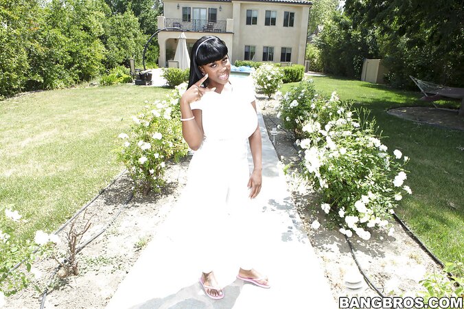 Black MILF strips to flaunt her gigantic boobs and a tight twat