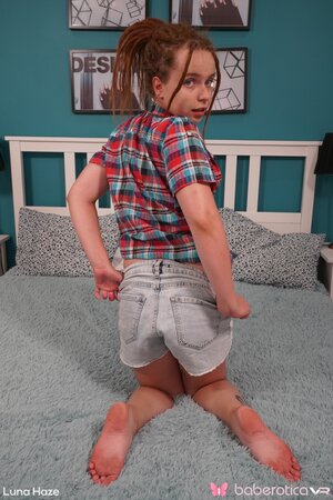 Tiny teen Luna Haze keeps her shirt and plays with a sex toy