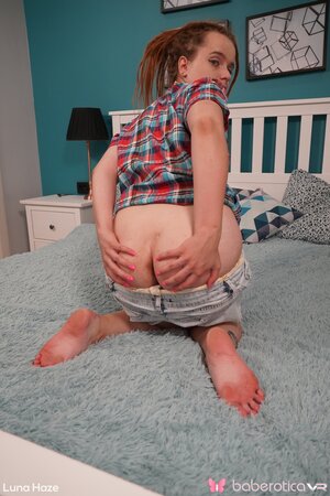 Tiny teen Luna Haze keeps her shirt and plays with a sex toy