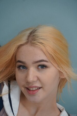 Sexy blonde schoolgirl Dina Soul plays with her sex toys