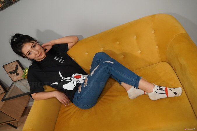 Cute Kaily keeps her socks on while playing with a sex toy