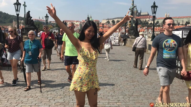 Stunning Asian girl poses outside and takes hard cock inside