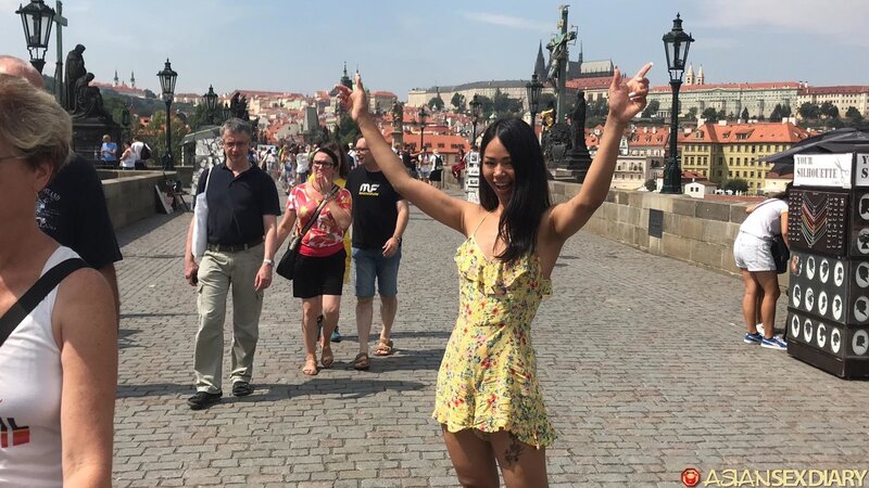 Stunning Asian girl poses outside and takes hard cock inside