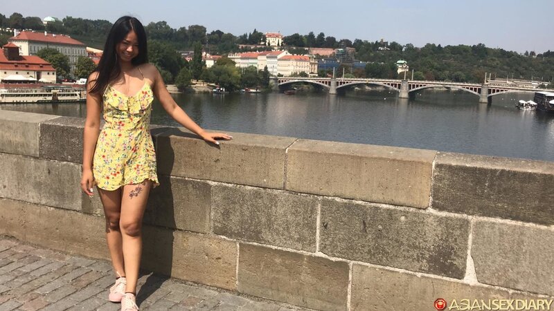 Stunning Asian girl poses outside and takes hard cock inside